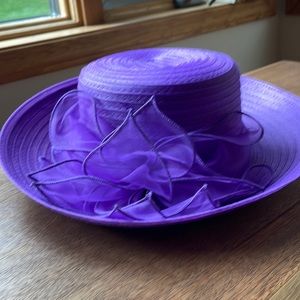 Purple bucket hat with bow adjustable string.